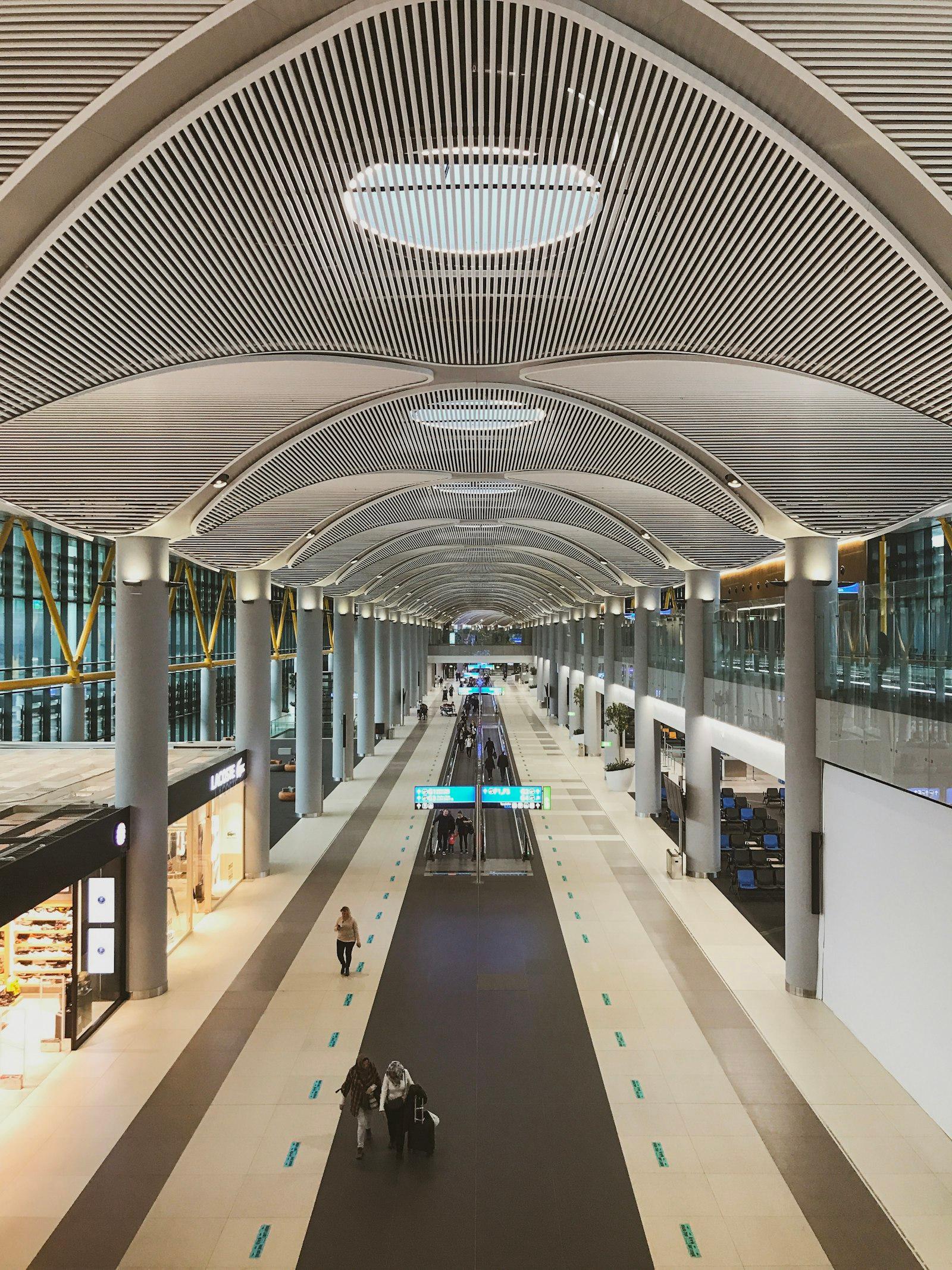 Long airside concourse at Istanbul Airport (IST) under its ribbed ceiling